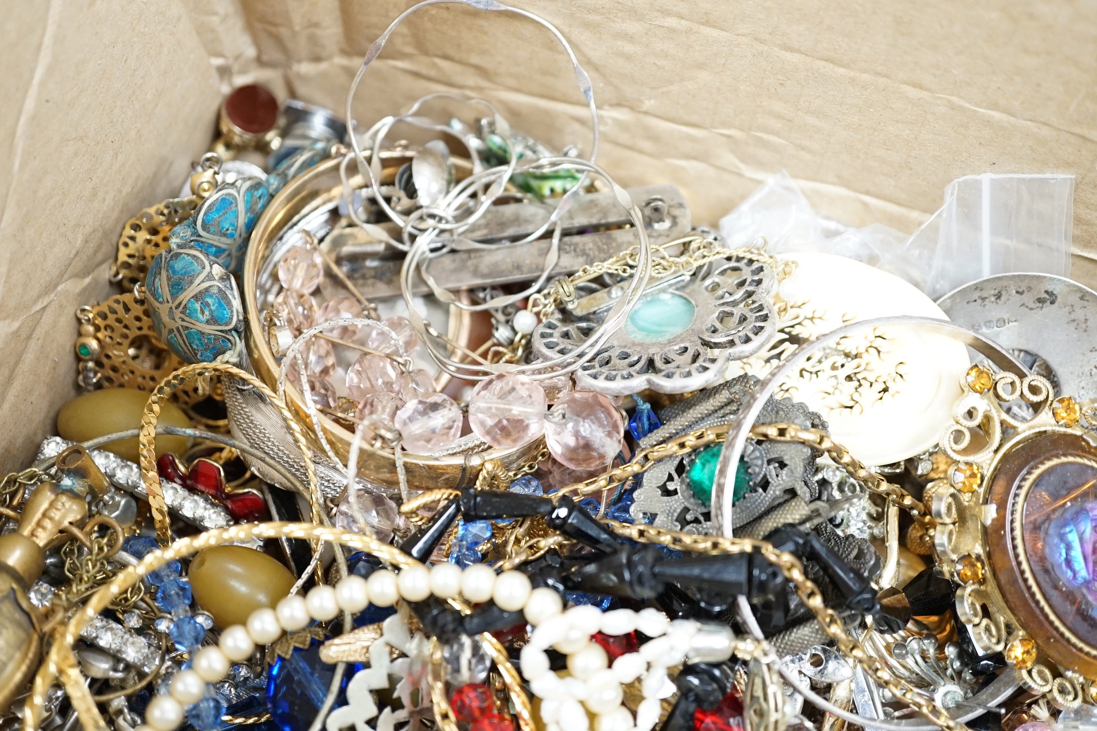 A quantity of mixed mainly costume jewellery, including bangles, necklaces brooches etc.